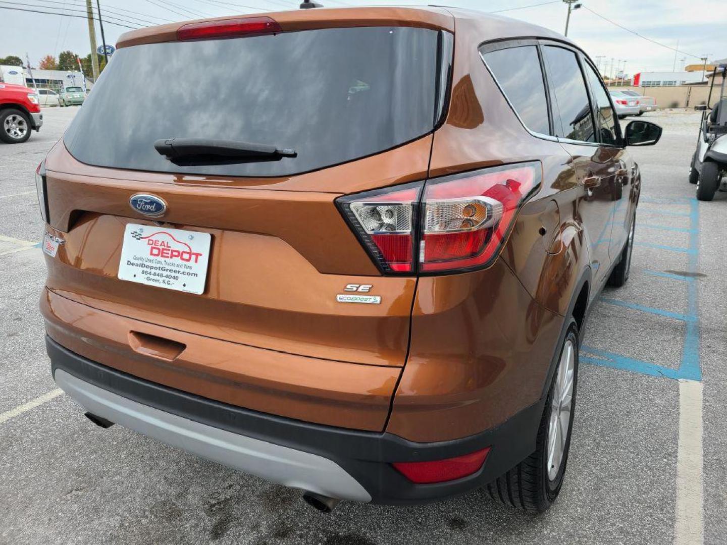 2017 ORANGE FORD ESCAPE SE (1FMCU0GDXHU) with an 1.5L engine, Automatic transmission, located at 13640 E Wade Hampton Blvd, Greer, SC, 29651, (864) 848-4040, 34.950825, -82.197464 - Photo#6