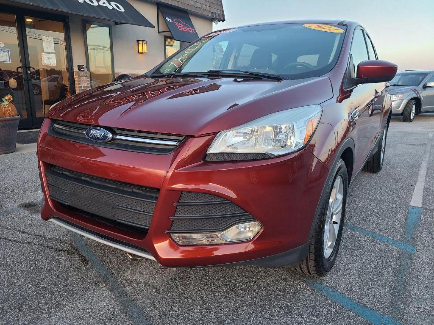 2014 OR/RED FORD ESCAPE SE (1FMCU0GX4EU) with an 1.6L engine, Automatic transmission, located at 13640 E Wade Hampton Blvd, Greer, SC, 29651, (864) 848-4040, 34.950825, -82.197464 - Photo#1