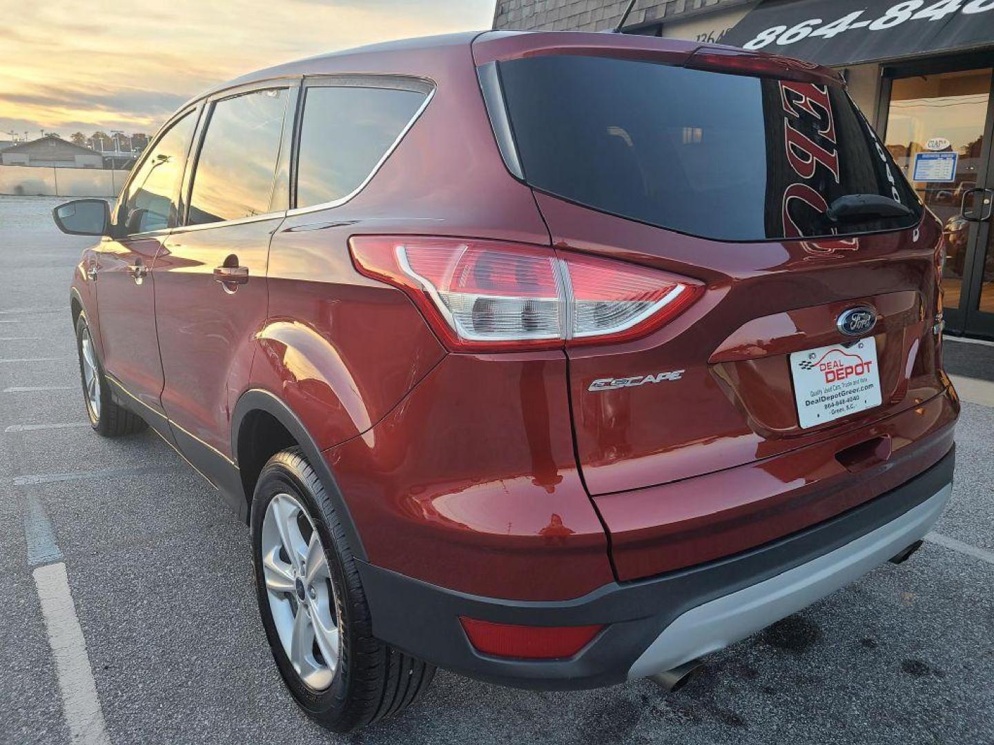 2014 OR/RED FORD ESCAPE SE (1FMCU0GX4EU) with an 1.6L engine, Automatic transmission, located at 13640 E Wade Hampton Blvd, Greer, SC, 29651, (864) 848-4040, 34.950825, -82.197464 - Photo#4