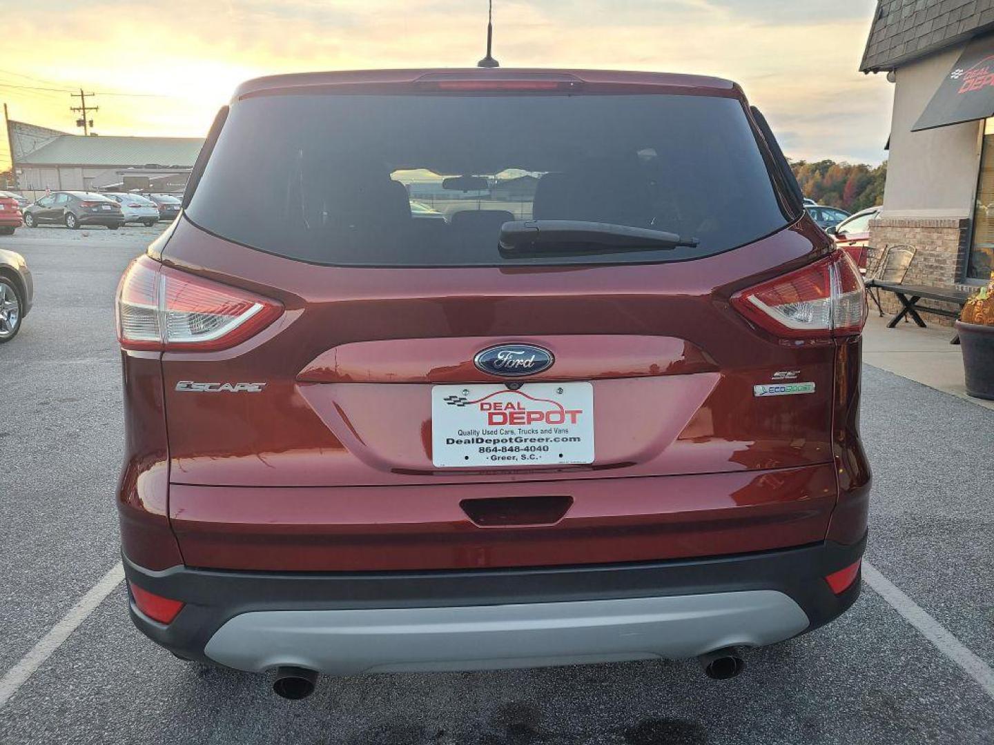 2014 OR/RED FORD ESCAPE SE (1FMCU0GX4EU) with an 1.6L engine, Automatic transmission, located at 13640 E Wade Hampton Blvd, Greer, SC, 29651, (864) 848-4040, 34.950825, -82.197464 - Photo#5