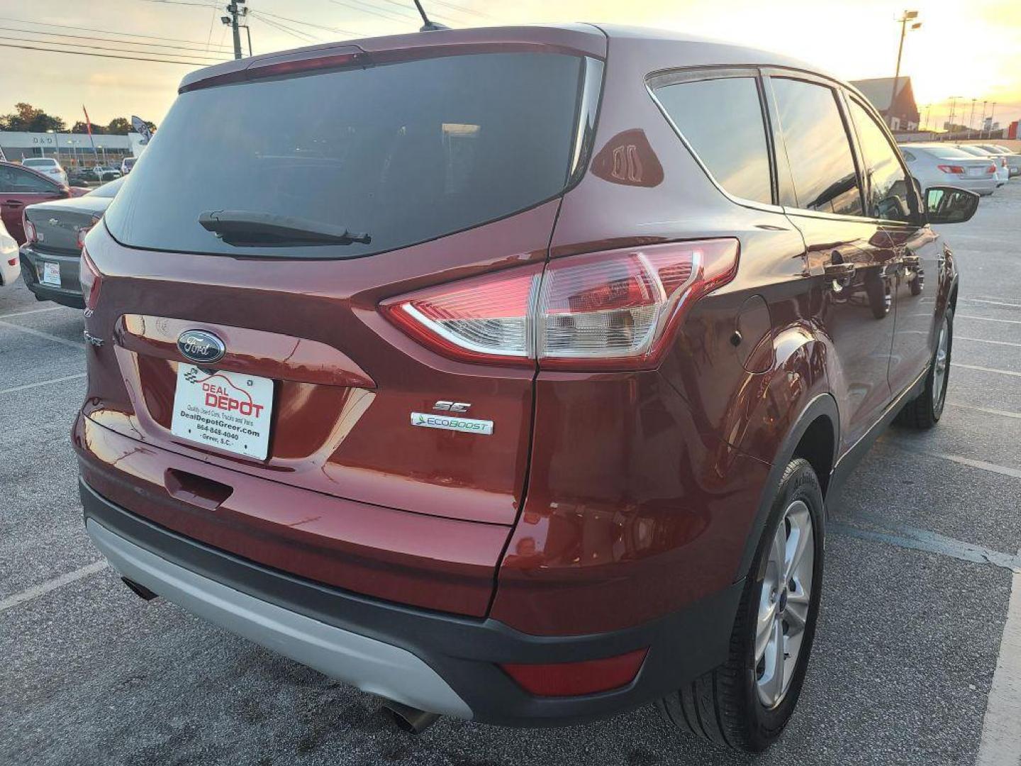 2014 OR/RED FORD ESCAPE SE (1FMCU0GX4EU) with an 1.6L engine, Automatic transmission, located at 13640 E Wade Hampton Blvd, Greer, SC, 29651, (864) 848-4040, 34.950825, -82.197464 - Photo#6
