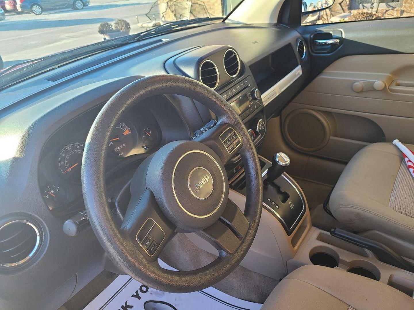 2014 RED JEEP COMPASS SPORT (1C4NJDBB9ED) with an 2.4L engine, 5-Speed Manual transmission, located at 13640 E Wade Hampton Blvd, Greer, SC, 29651, (864) 848-4040, 34.950825, -82.197464 - Photo#8